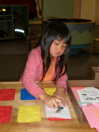 Kasen making pictures at the Discovery Center